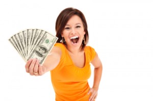 woman holding up lots of cash