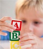 a child who is building with blocks
